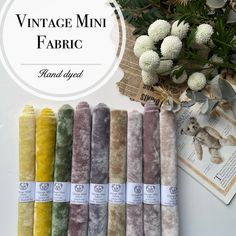 the vintage mini fabric bundle is laid out on a table with flowers and other items