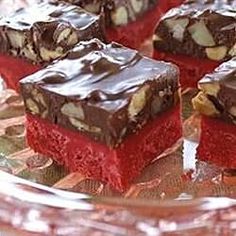 several pieces of red velvet cake on a glass plate