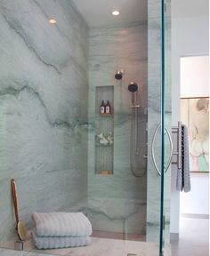 a bathroom with marble walls and flooring