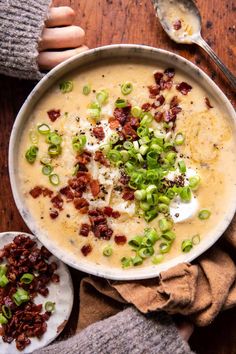 a bowl of potato soup with bacon and green onions