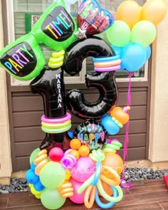 an image of balloons and streamers in front of the door for a 30th birthday party