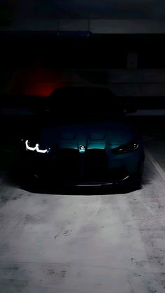 a car that is sitting in the dark