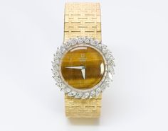 Universal Geneve Watch.Vintage Universal Geneve yellow gold and diamond with tiger eye dial ladies watch. Approximate Measurements: Length 6.5" Universal Geneve, Diamond Watches Women, Watch Vintage, Ladies Watch, Diamond Watch, Sparkle Diamonds, Buy Vintage, Watch Brands, Vintage Watches