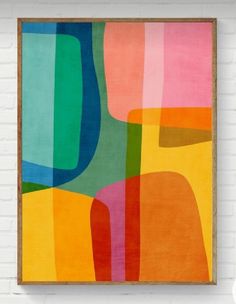 an abstract painting hanging on the wall