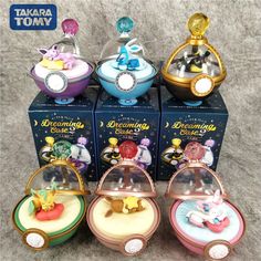 five disney figurines are sitting on top of each other in front of a box