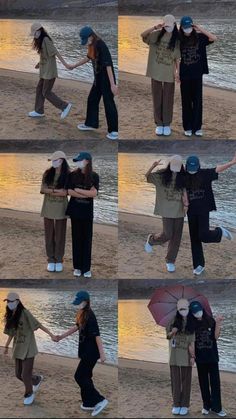 two people are standing on the beach with their arms around each other