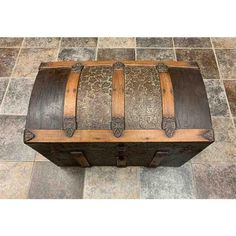 an old wooden trunk sitting on the floor