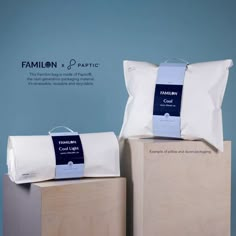 two pillows sitting on top of each other in front of a blue background with the words famillon and pacific