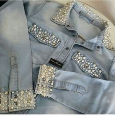 some very pretty blue jean jackets with pearls on them