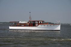 a large white boat floating on top of a body of water