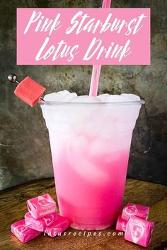 a pink drink with marshmallows in it and a sign that says pink starburst let's drink