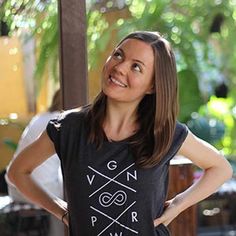 a woman standing with her hands on her hips wearing a t - shirt that says vegan power