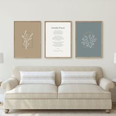 three framed art prints on the wall above a couch