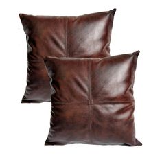 two brown leather pillows sitting on top of each other