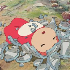 a cartoon character laying on the ground surrounded by debris