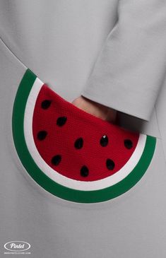 a watermelon patch on the back of a man's shirt