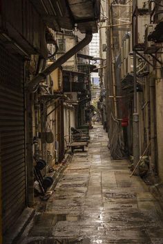 an alley way with lots of buildings on both sides