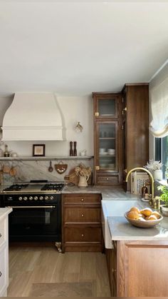 a kitchen with an oven, stove and counter tops in wood grained finish tones