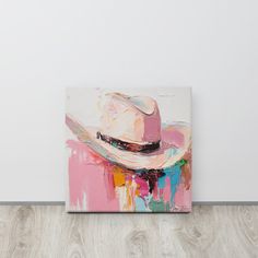 a painting on the wall with a cowboy hat