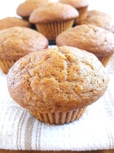 several muffins sitting on top of a white cloth