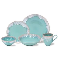 a set of blue dishes and cups on a white background