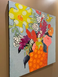 an abstract painting of flowers in a vase on a gray wall with polka dot dots