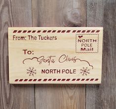 a wooden sign that says from the tuckers to santa claus north pole