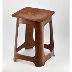 a small wooden stool on a white background