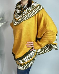 Mustard/Yellow Alpaca Blend Women's Luxury Poncho from The Andes Of Peru. Beautifully crafted poncho sweater, layered with Inca designs. Warm and perfect sweater to wear with jeans or pants, unique and stylish piece goes with just about everything. Comfortable wide cape -  Nice V-neck poncho sweater at the front and rounded at the back ideal for cold winter seasons. Size: One Size / They are all one size/standard Measurements:   L 70 cm / 28 inch - W 98 cm / 38 inch approximate CARE TIPS: - Machine wash on wool program at 30 o C, or just cold water by hand. - Use a detergent for wool. - Do Not Use Spin Cycle or dryers. Air dry. Each piece is uniquely made, it means that you will receive a truly unique product which is why slight difference since it is individually handmade. Colors may appe Trendy One Size Batwing Sleeve Sweater, Yellow Acrylic Sweater For Winter, Yellow Acrylic Winter Sweater, Soft Knit Yellow Top For Winter, Yellow Knitted Oversized Top, Oversized Knitted Yellow Top, Yellow Oversized Knitted Top, Oversized Yellow Knitted Tops, Yellow Turtleneck Top For Winter