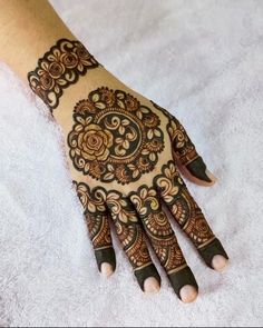 a henna tattoo on someone's hand