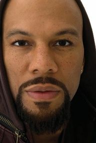 a close up of a person wearing a hoodie and looking at the camera with a serious look on his face