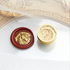 two wooden buttons sitting on top of a table