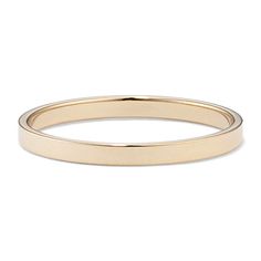 a plain gold wedding ring with a thin band in the middle, on a white background