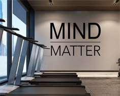 there is a gym with treads in front of the wall that says mind matter