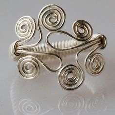 a silver ring sitting on top of a table