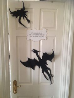 a white door with some black bats on it