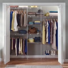 an organized closet with clothes and shoes