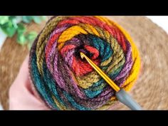 a ball of yarn with a crochet needle in it