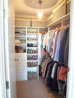 the closet is full of clothes and shoes