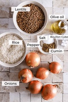 an overhead view of different types of food in bowls on a tile floor with labels labeled