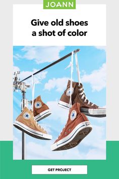 two pairs of shoes hanging from a clothes line with the words joann give old shoes a shot of color get project