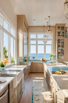 a kitchen with lots of counter space and large windows that look out to the ocean