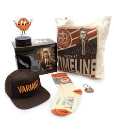 a hat, tie, and other items are laid out in front of a bag