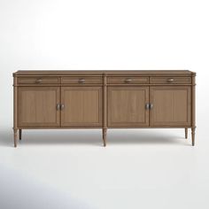 the sideboard is made out of wood and has two doors on one side, and three drawers on the other