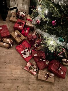 presents under the christmas tree on the floor