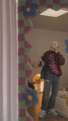 a man taking a selfie in front of a mirror