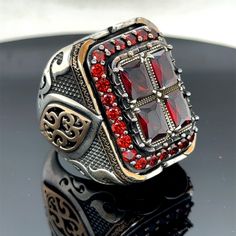 Silver Man Large Ruby Ring , Handmade Ottoman Style Red Stone Square Ring, Big Red Stone Ring , Zircon Stone Ring, 925k Sterling Silver Ring ★Item Details * Gender : Male / Female * Material : 925K Sterling Silver * Total weight : 42 Grams * Gemstone : Ruby  Stone ✔ Ready to Ship in 1-2 Business Days .. ✔ Shipped to the Worldwide 1-5 business days with free shipping... ✔ The product will be sent to you with a handmade wooden box to avoid any damage during shipping... ✔ Visit our store, browse other Men's jewelry, silver and gold collections, and find the perfect piece you're looking for... Click For Our Other Products https://www.etsy.com/shop/MercansilverTR?ref=simple-shop-header-name&listing_id=1003010735 Red Garnet Ring For Gift, Red Garnet Rings With Polished Finish, Luxury Handmade Red Jewelry, Red Polished Finish Signet Ring As Gift, Unique Red Ring With Polished Finish, Unique Red Rings With Polished Finish, Red Hallmarked Open Ring Jewelry, Collectible Red Rings With Polished Finish, Red Ruby Ring With Polished Finish Gift