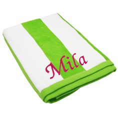 a green and white striped towel with the word mia on it's front side