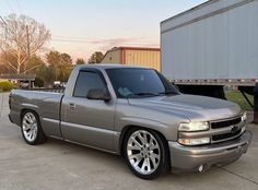 a silver truck parked in a parking lot