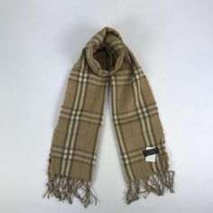 Vintage Burberry Scarf/Muffler/Wool Scarves - FOC41331.  Size 12 inch x 57 inch.  Material Wool.  In good Condition overall.  Note: Item sold without original box and receipt.  FOC41331.  We do combining shipping.  Note: Item sold without original box and receipt.   Please Read Before Purchase. Drop your phone number. Tracking number can be tracked 3 - 5 days after shipment process. Please be patient waiting. This design and style by wearing it increases your confidence. All pieces are measured Classic Beige Scarves For Fall, Classic Beige Scarf For Fall, Classic Brown Winter Scarves, Classic Brown Winter Scarf, Classic Plaid Scarves For Winter, Plaid Winter Scarves One Size, Winter Plaid Scarves One Size, Classic Winter Scarves For Cold Weather, Beige Wool Scarves For Winter